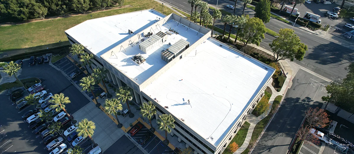 Commercial building roof with expertly applied coating