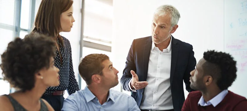 Group of leaders speaking with each other